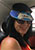 An image of my wife with Uber cap in an Uber car.