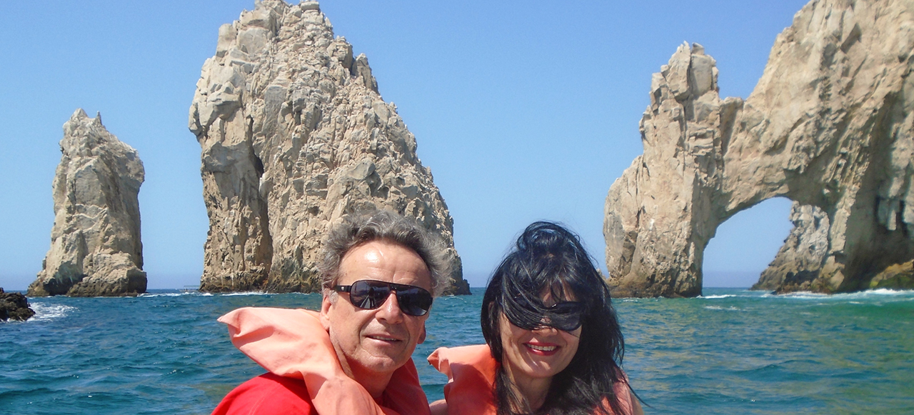 An image of my wife and me with the Arch in the background