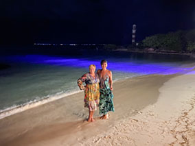 Two ladies enjoying the dinner at the beach